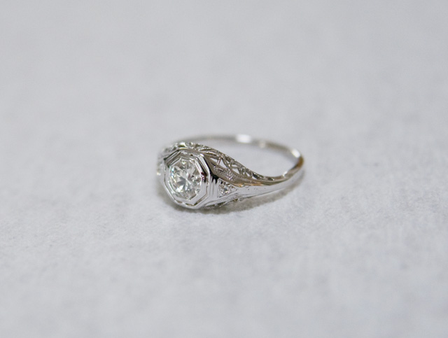 An Art Deco diamond and filigree white gold engagement ring