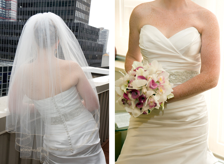 A bride wearing a veil and holding a wedding bouquet of orchids.