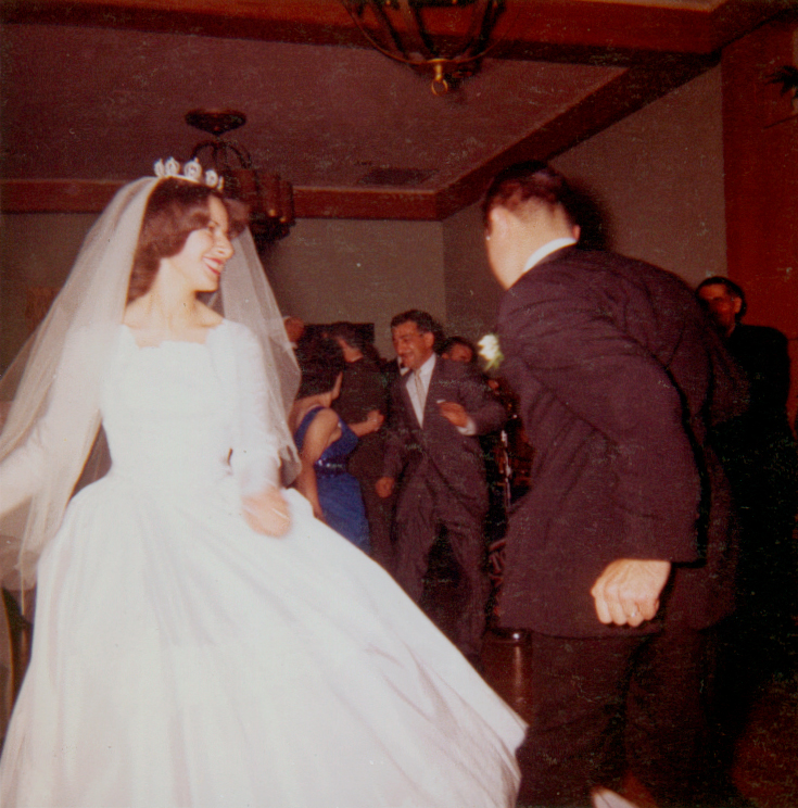 1960s bride and groom dancing at their wedding reception